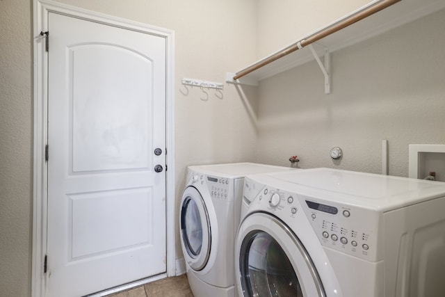 103 Aria Rdg Unit 902, Austin, TX 78738 - laundry area with washer and dryer and light tile patterned floors
