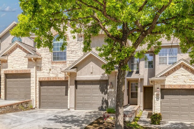 103 Aria Rdg Unit 902, Austin, TX 78738 - view of front of house featuring driveway, stone siding, and stucco siding