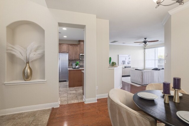 103 Aria Rdg Unit 902, Austin, TX 78738 - dining area with ceiling fan, ornamental molding, light wood finished floors, and recessed lighting