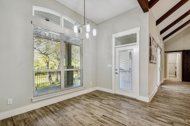 1609 Havenwood Blvd, New Braunfels, TX 78132 - unfurnished dining area featuring a chandelier, wood finished floors, and baseboards