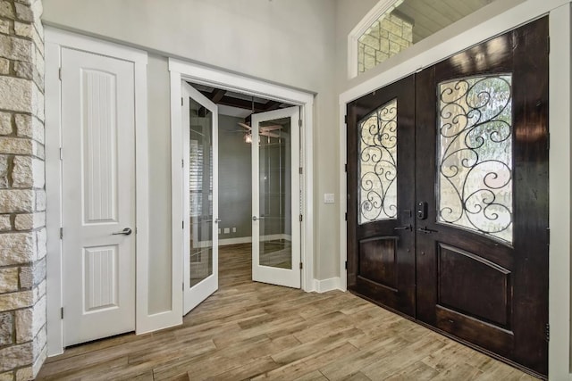 1609 Havenwood Blvd, New Braunfels, TX 78132 - foyer with french doors, wood finished floors, baseboards, and ceiling fan