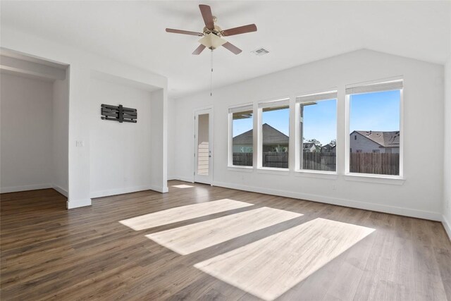 105 Lemuel Crawford Trl, Bastrop, TX 78602 - interior space with visible vents, baseboards, a ceiling fan, vaulted ceiling, and wood finished floors