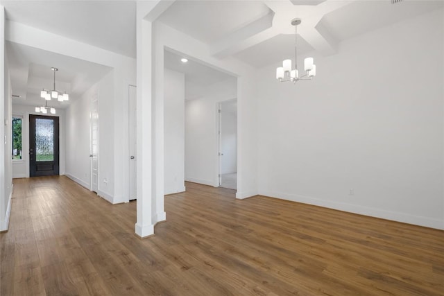 105 Lemuel Crawford Trl, Bastrop, TX 78602 - entrance foyer featuring baseboards, an inviting chandelier, and wood finished floors