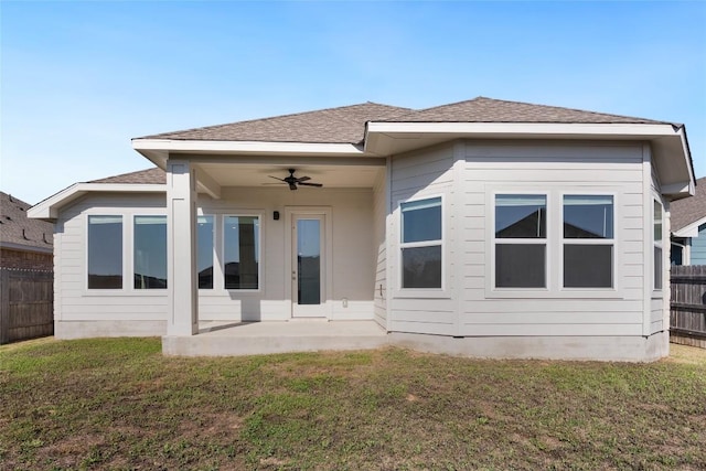 105 Lemuel Crawford Trl, Bastrop, TX 78602 - back of house with a patio, ceiling fan, a yard, fence, and a shingled roof
