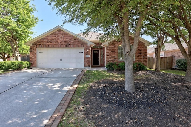 806 Broken Trace Ct, Round Rock, TX 78665 - view of front of property featuring brick siding, a garage, and driveway