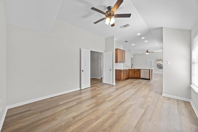 806 Broken Trace Ct, Round Rock, TX 78665 - unfurnished living room featuring ceiling fan, baseboards, light wood-style flooring, recessed lighting, and a sink