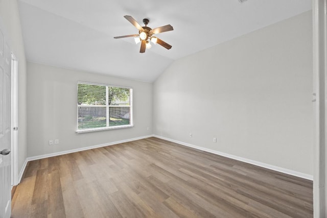 806 Broken Trace Ct, Round Rock, TX 78665 - empty room featuring a ceiling fan, wood finished floors, lofted ceiling, and baseboards