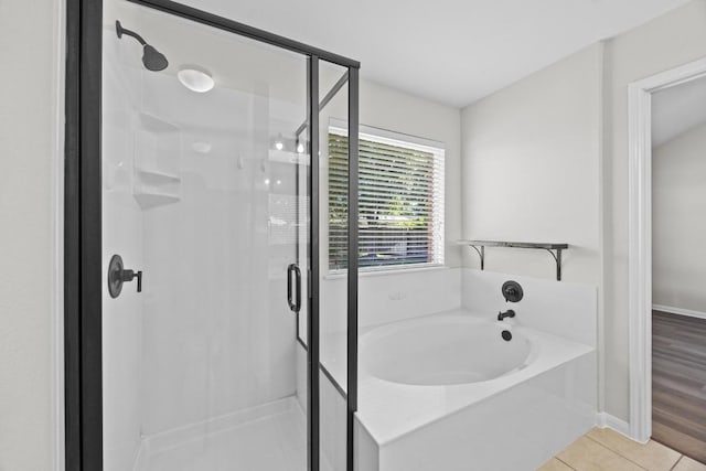 806 Broken Trace Ct, Round Rock, TX 78665 - full bathroom with a garden tub, a stall shower, tile patterned flooring, and baseboards