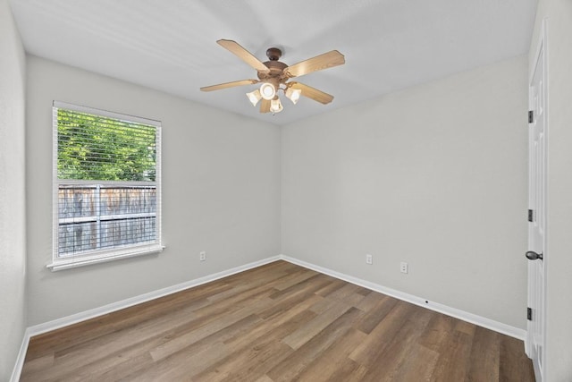 806 Broken Trace Ct, Round Rock, TX 78665 - spare room featuring wood finished floors, ceiling fan, and baseboards