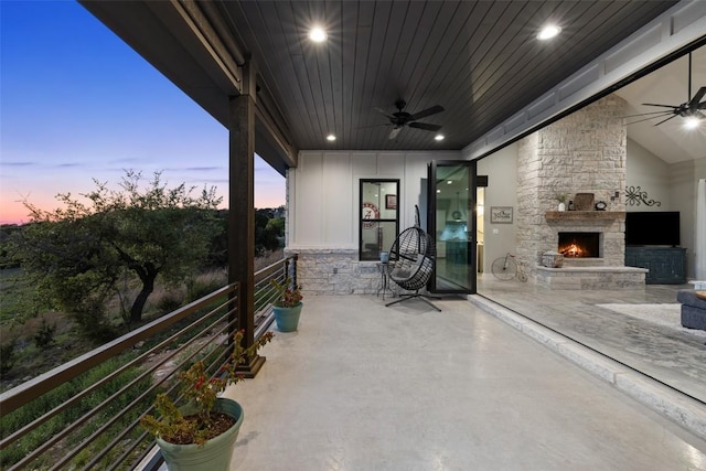 468 Cedar Mountain Dr, Marble Falls, TX 78654 - view of patio featuring a ceiling fan and an outdoor stone fireplace