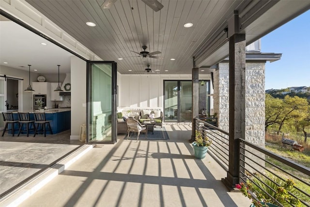 468 Cedar Mountain Dr, Marble Falls, TX 78654 - balcony featuring a ceiling fan, a bar, and an outdoor living space