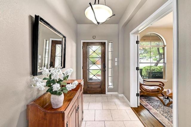 21940 Agarito Ln, Spicewood, TX 78669 - foyer with baseboards and light tile patterned floors