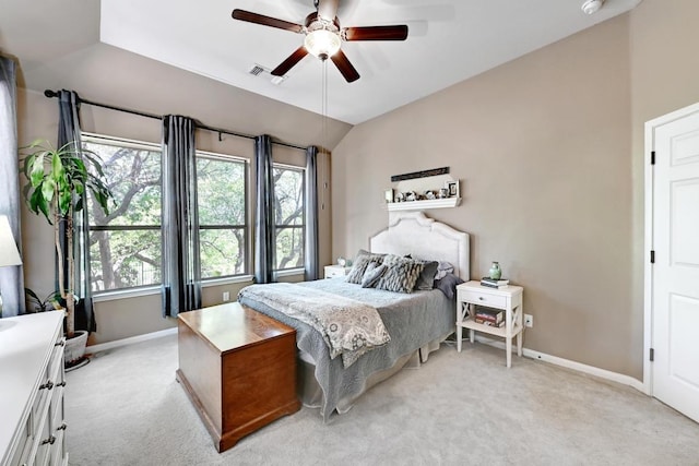 21940 Agarito Ln, Spicewood, TX 78669 - bedroom featuring baseboards, light carpet, multiple windows, lofted ceiling, and a ceiling fan