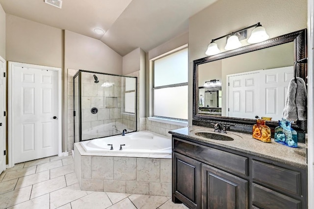 21940 Agarito Ln, Spicewood, TX 78669 - full bathroom with a garden tub, vanity, tile patterned flooring, a stall shower, and lofted ceiling