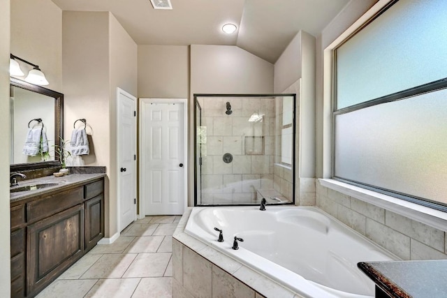 21940 Agarito Ln, Spicewood, TX 78669 - bathroom featuring vanity, a garden tub, a shower stall, tile patterned flooring, and lofted ceiling