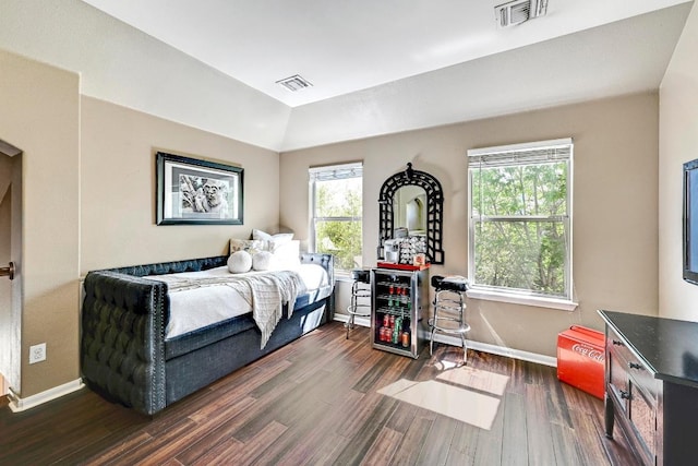 21940 Agarito Ln, Spicewood, TX 78669 - bedroom featuring multiple windows, baseboards, and dark wood-type flooring
