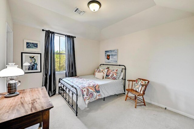 21940 Agarito Ln, Spicewood, TX 78669 - bedroom with light carpet, baseboards, and lofted ceiling
