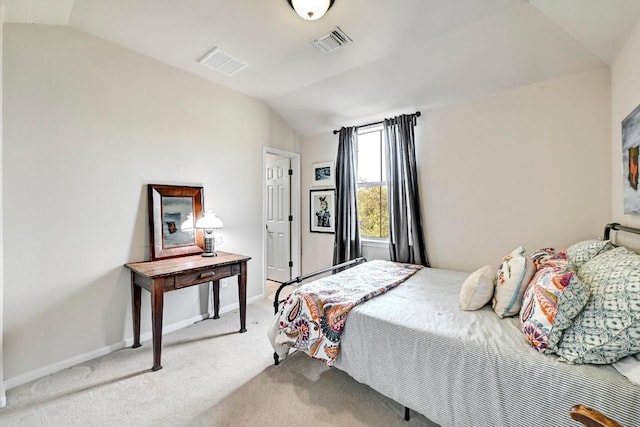21940 Agarito Ln, Spicewood, TX 78669 - bedroom featuring vaulted ceiling, light carpet, and baseboards