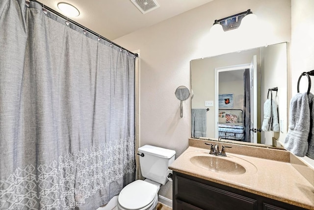 21940 Agarito Ln, Spicewood, TX 78669 - full bath featuring toilet, vanity, and a shower with shower curtain
