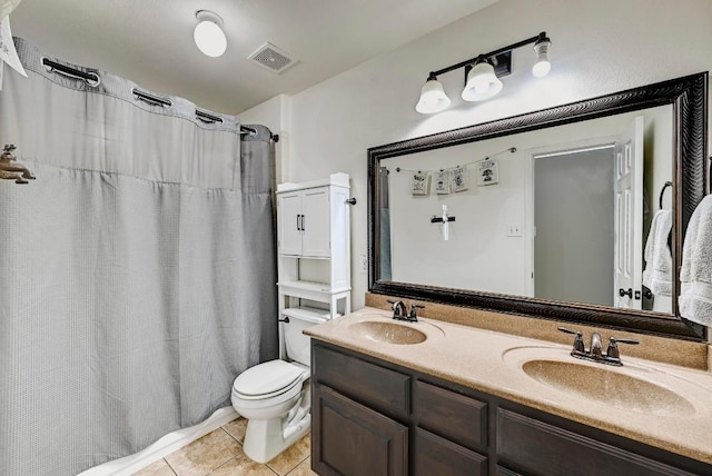 21940 Agarito Ln, Spicewood, TX 78669 - full bath with toilet, double vanity, tile patterned flooring, and curtained shower