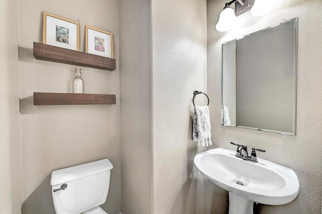 21940 Agarito Ln, Spicewood, TX 78669 - bathroom with toilet and a sink