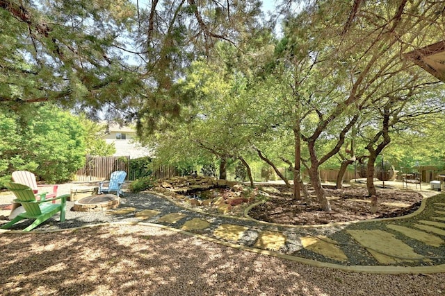 21940 Agarito Ln, Spicewood, TX 78669 - view of yard with an outdoor fire pit and a patio