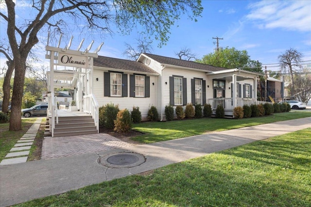 313 W 17th St Unit 2403, Austin, TX 78701 - ranch-style home featuring a front yard