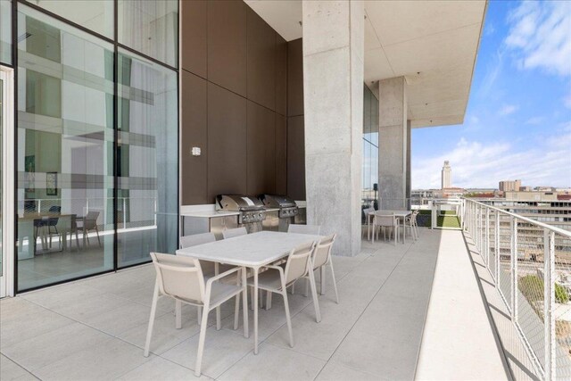 313 W 17th St Unit 2403, Austin, TX 78701 - balcony with outdoor dining space, a grill, and exterior kitchen