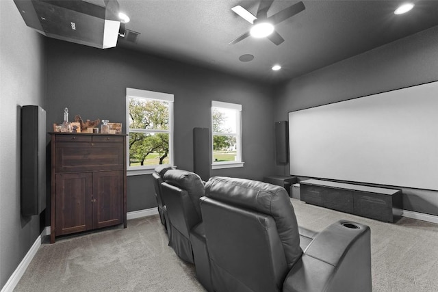 cinema featuring light colored carpet, baseboards, a ceiling fan, and recessed lighting