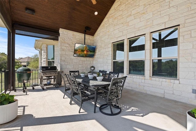 view of patio / terrace featuring outdoor dining space and a grill
