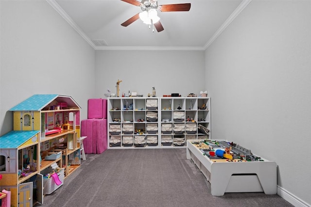 game room with ornamental molding, ceiling fan, and carpet floors