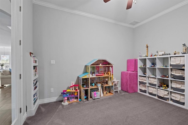 game room featuring ornamental molding, a ceiling fan, baseboards, and carpet flooring