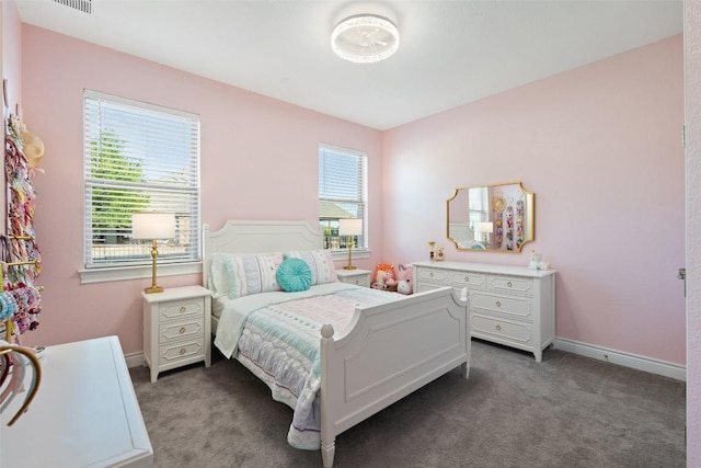 carpeted bedroom with baseboards