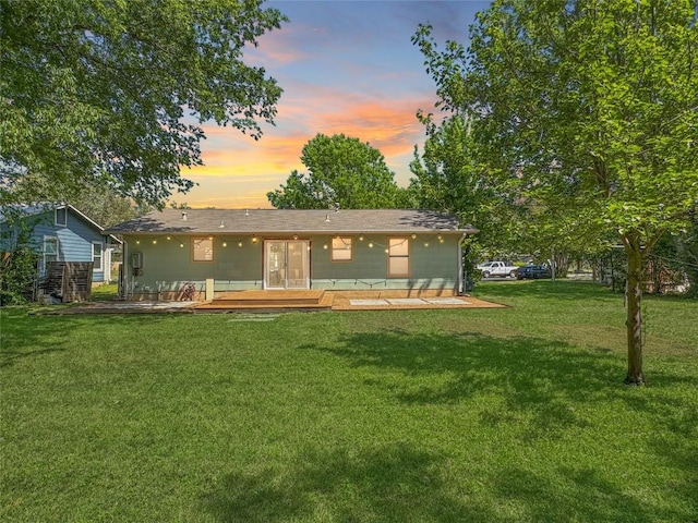 5306 Wellington Dr, Austin, TX 78723 - back of house with a yard and a deck