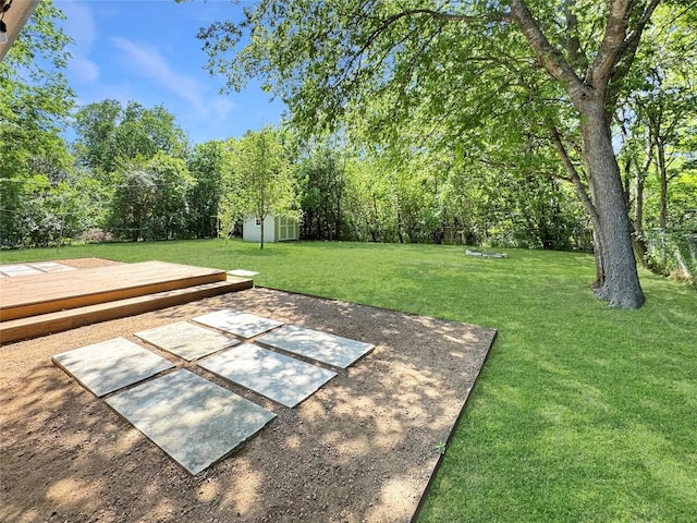 5306 Wellington Dr, Austin, TX 78723 - view of grassy yard featuring a wooden deck