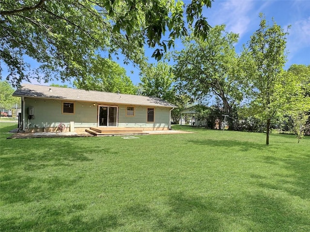 5306 Wellington Dr, Austin, TX 78723 - back of property featuring a lawn, a patio, and a wooden deck