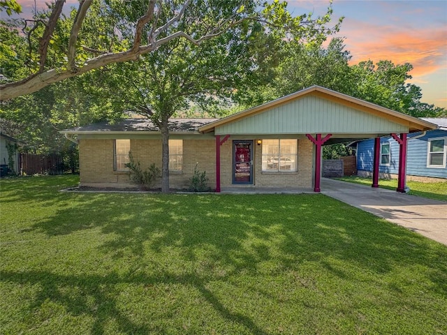 5306 Wellington Dr, Austin, TX 78723 - ranch-style home with concrete driveway, brick siding, and an attached carport