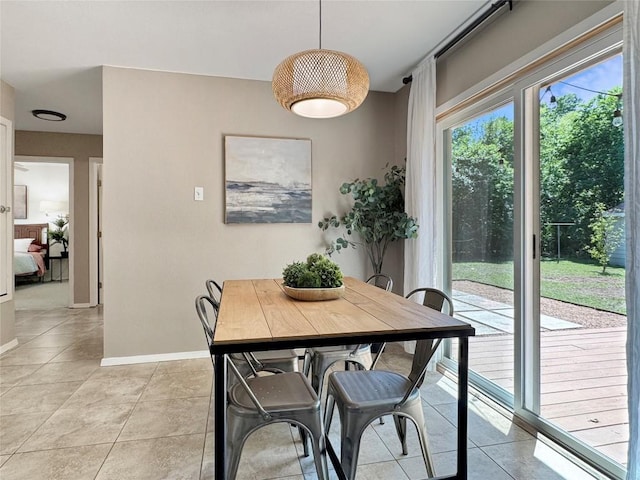 5306 Wellington Dr, Austin, TX 78723 - dining room with light tile patterned floors and baseboards