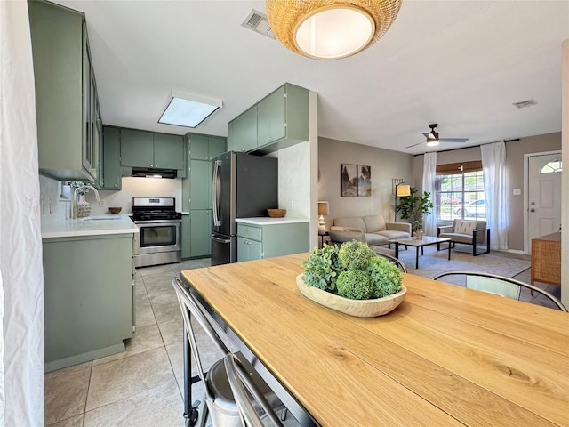 5306 Wellington Dr, Austin, TX 78723 - dining space featuring ceiling fan and light tile patterned floors