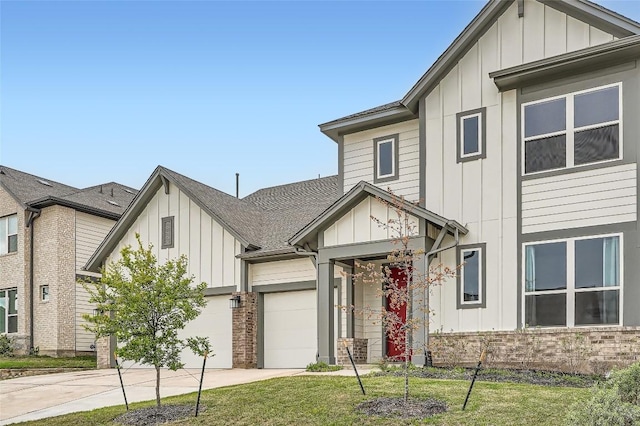 650 Texas Sage Loop, Buda, TX 78610 - modern farmhouse style home with concrete driveway, roof with shingles, board and batten siding, a front yard, and a garage