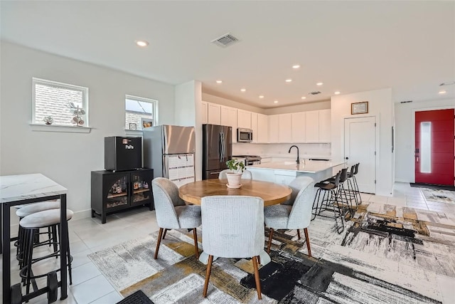 650 Texas Sage Loop, Buda, TX 78610 - dining space with visible vents, baseboards, recessed lighting, and light tile patterned floors