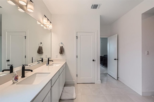 650 Texas Sage Loop, Buda, TX 78610 - bathroom with a sink, visible vents, and baseboards