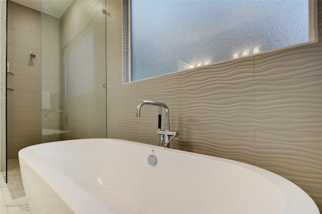 5001 Shoal Creek Blvd, Austin, TX 78756 - bathroom with a soaking tub and marble finish flooring