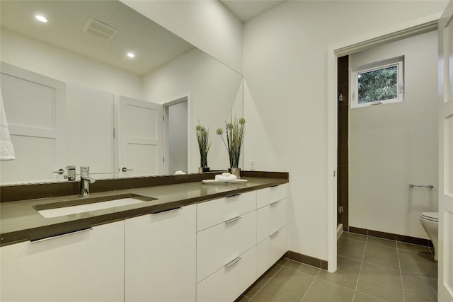 5001 Shoal Creek Blvd, Austin, TX 78756 - full bath with double vanity, a shower, tile patterned flooring, and recessed lighting