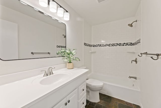 8014 Stillwood Ln, Austin, TX 78757 - full bathroom featuring vanity, stone finish flooring, and bathtub / shower combination
