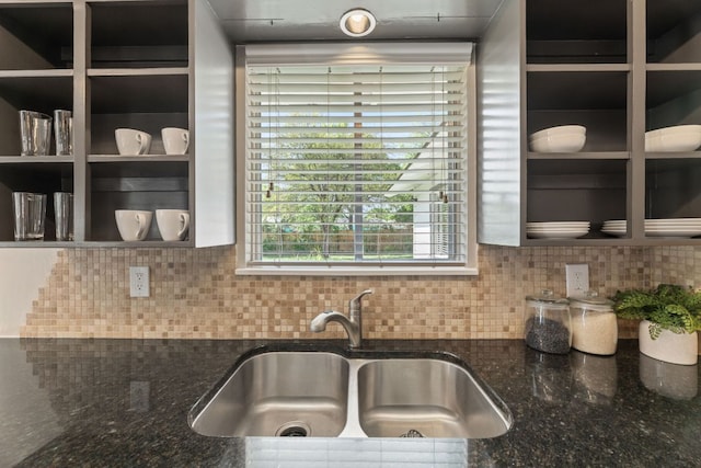 8014 Stillwood Ln, Austin, TX 78757 - kitchen with dark stone counters and backsplash