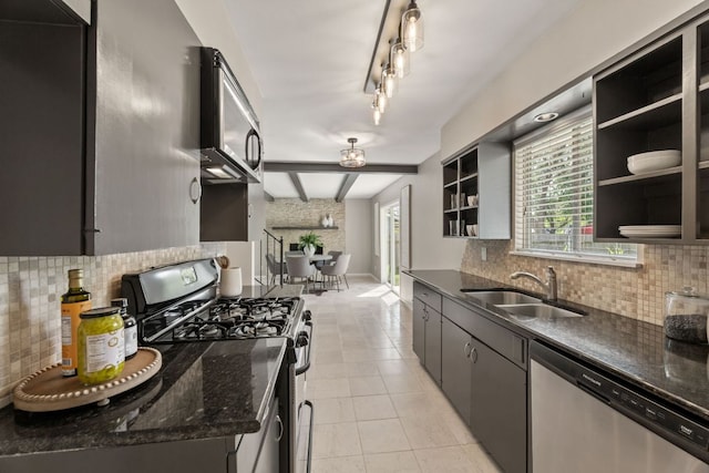 8014 Stillwood Ln, Austin, TX 78757 - kitchen featuring appliances with stainless steel finishes, backsplash, open shelves, and a sink