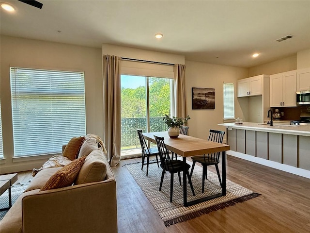 1811 Webberville Rd Unit 1206, Austin, TX 78721 - dining area featuring dark wood finished floors, recessed lighting, and a ceiling fan
