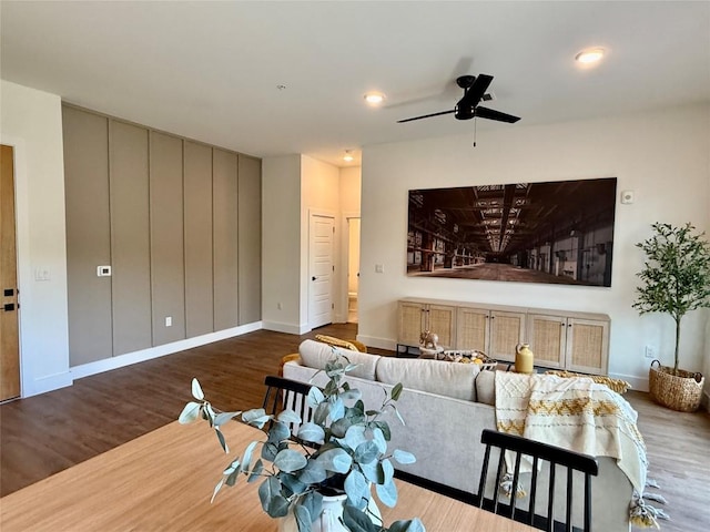 1811 Webberville Rd Unit 1206, Austin, TX 78721 - living room with wood finished floors, a ceiling fan, and baseboards