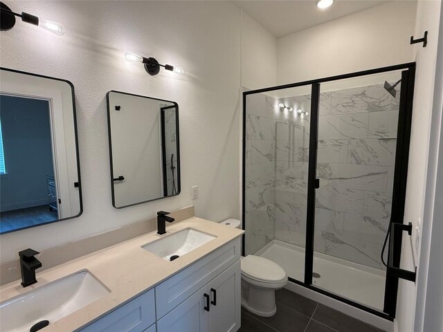 1811 Webberville Rd Unit 1206, Austin, TX 78721 - full bath featuring toilet, a marble finish shower, double vanity, and tile patterned flooring